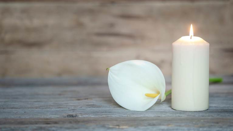 A candle and a flower